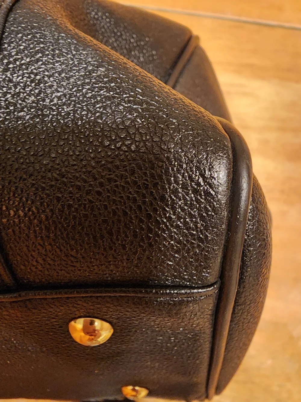 MCM Black Leather Boston Bag featuring polished gold-tone hardware